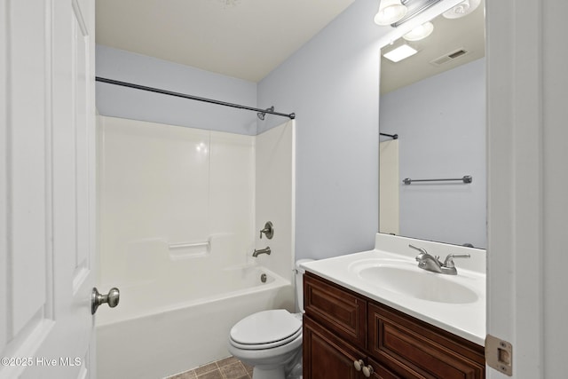 bathroom featuring vanity, toilet, visible vents, and shower / washtub combination