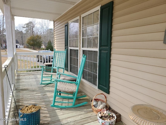 wooden terrace featuring a porch