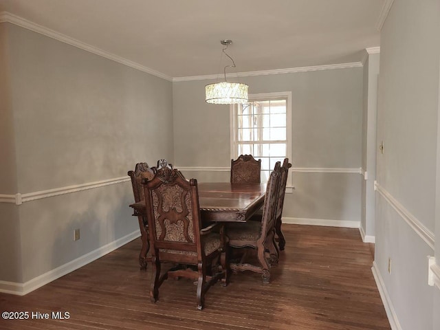 dining room featuring an inviting chandelier, crown molding, baseboards, and wood finished floors