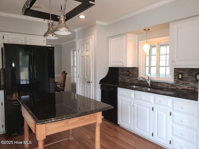 kitchen featuring a sink, black appliances, wood finished floors, and white cabinetry