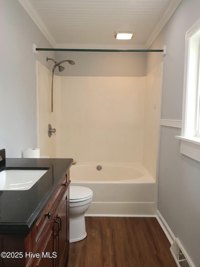 full bathroom featuring wood finished floors, visible vents,  shower combination, ornamental molding, and toilet