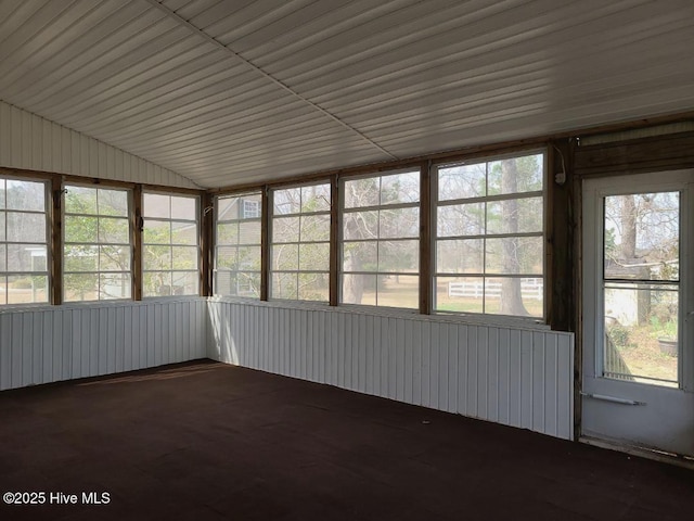 unfurnished sunroom with lofted ceiling