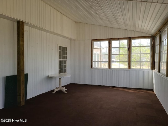 unfurnished sunroom with lofted ceiling