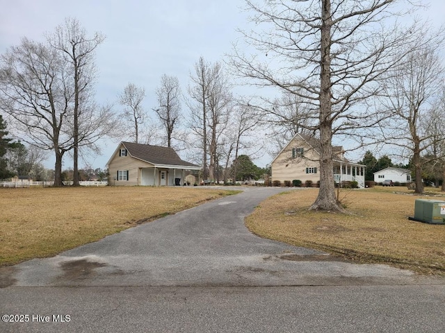 view of street featuring aphalt driveway