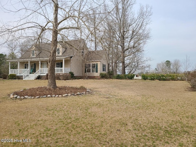 cape cod home featuring covered porch and a front lawn