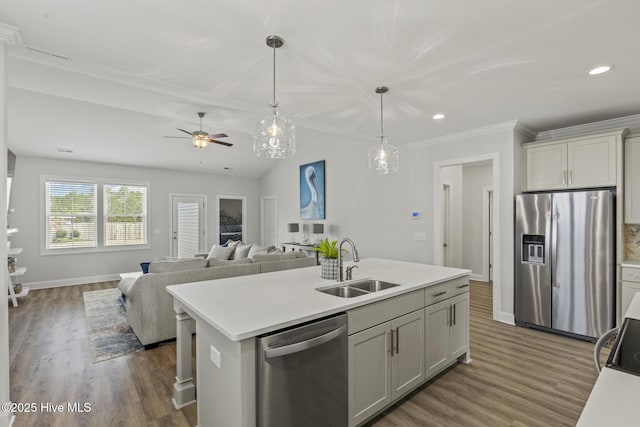 kitchen featuring ceiling fan, light countertops, appliances with stainless steel finishes, and a sink