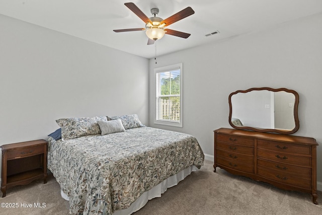 bedroom featuring visible vents, ceiling fan, and carpet