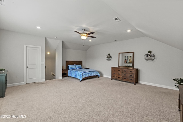 carpeted bedroom with visible vents, baseboards, and vaulted ceiling