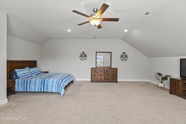 bedroom with lofted ceiling, baseboards, visible vents, and carpet floors