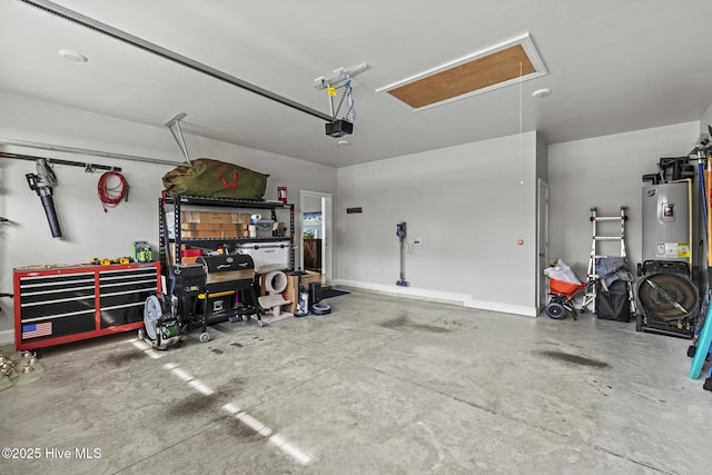 garage with a garage door opener, baseboards, and electric water heater