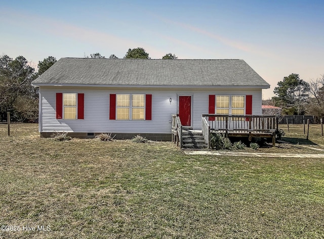 view of front of home with crawl space, a wooden deck, a front yard, and a shingled roof