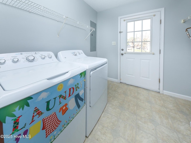 washroom featuring washer and dryer, laundry area, electric panel, and baseboards