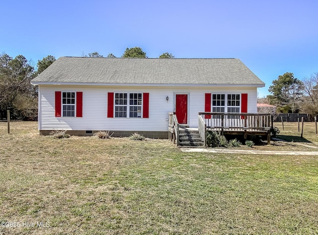 ranch-style house featuring crawl space, roof with shingles, a deck, and a front yard