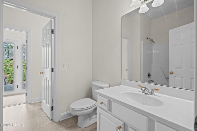 full bath featuring baseboards, toilet, tile patterned floors, vanity, and a shower