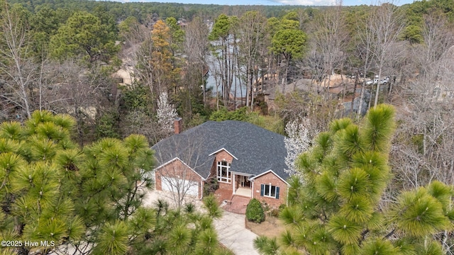 drone / aerial view featuring a forest view