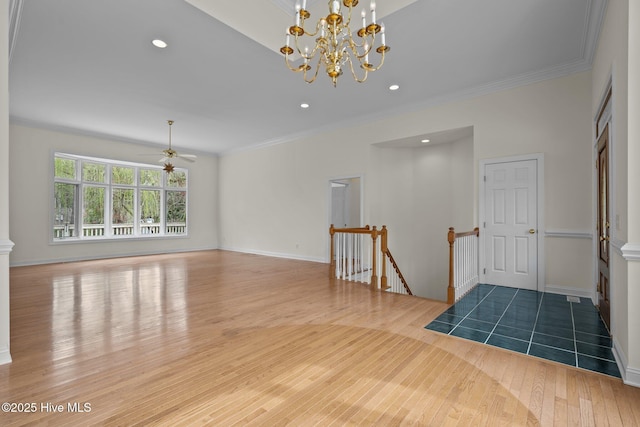 interior space featuring recessed lighting, wood-type flooring, ornamental molding, and ceiling fan with notable chandelier