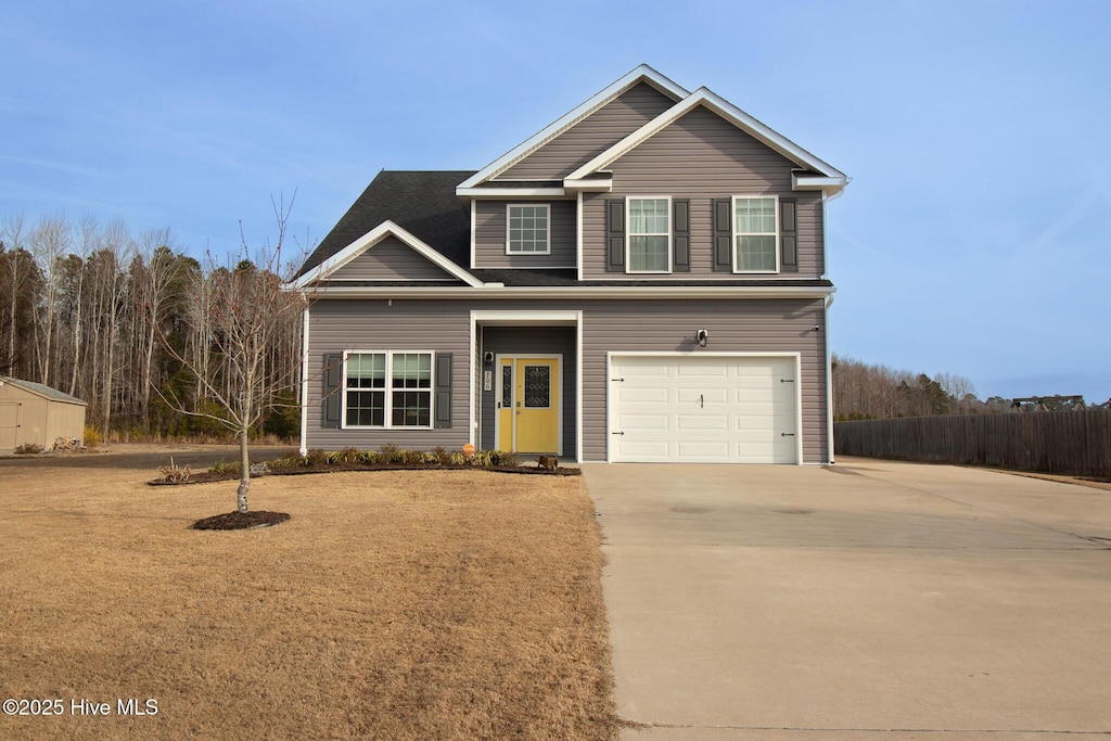 view of front of home featuring concrete driveway and an attached garage