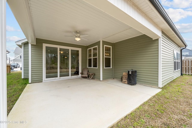 view of patio with an attached carport and a ceiling fan