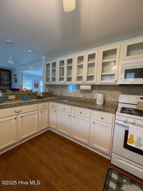 kitchen featuring light wood-style flooring, dishwasher, ceiling fan, a sink, and white cabinets