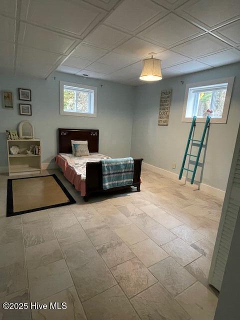 basement with a brick fireplace