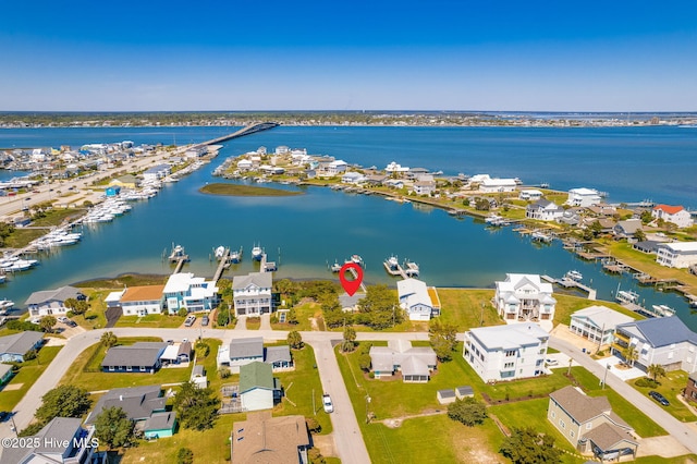 bird's eye view with a residential view and a water view