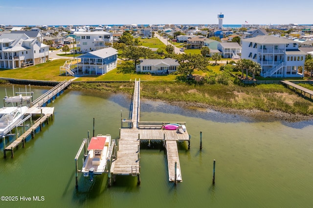 view of dock featuring a water view and a residential view