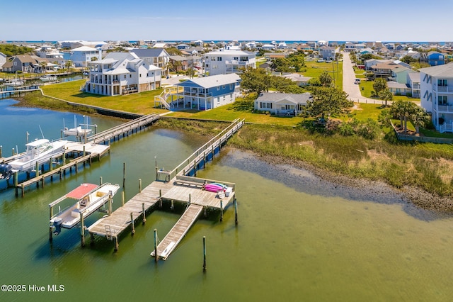 dock area featuring a residential view, a water view, and boat lift