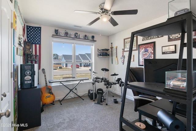 workout room with visible vents, baseboards, a ceiling fan, and carpet floors