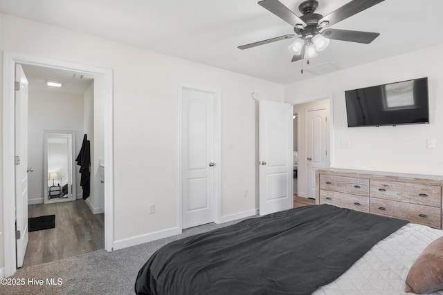 carpeted bedroom with baseboards and ceiling fan