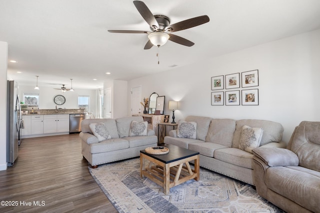 living area featuring recessed lighting, a ceiling fan, and wood finished floors