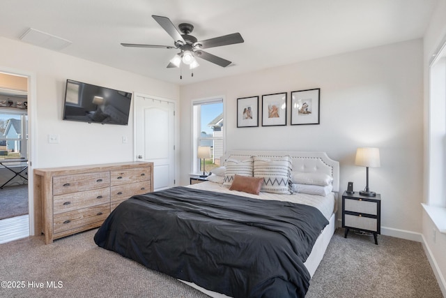 bedroom featuring baseboards, a ceiling fan, and carpet flooring