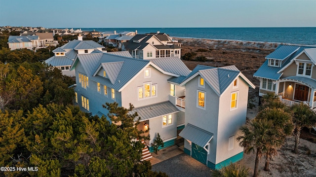 bird's eye view featuring a residential view and a water view