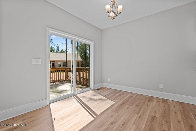 747 Warbler Pl, Vass, NC 28394 - interior space featuring a notable chandelier, light wood-style floors, and baseboards