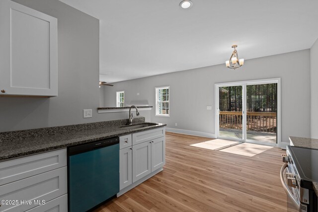 747 Warbler Pl, Vass, NC 28394 - kitchen with light wood-style flooring, a sink, stainless steel electric stove, a peninsula, and dishwashing machine