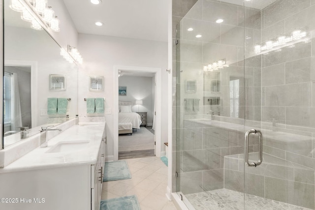 ensuite bathroom featuring vanity, recessed lighting, a shower stall, ensuite bathroom, and tile patterned floors