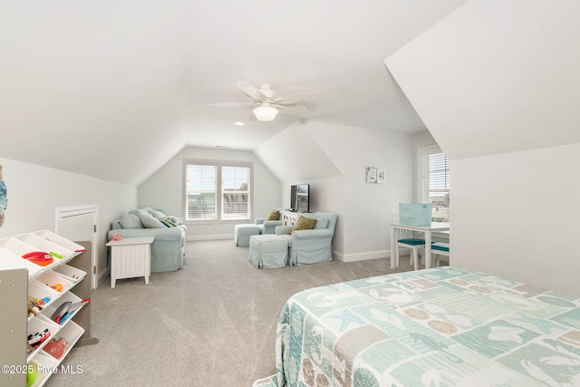 carpeted bedroom with baseboards, a ceiling fan, and vaulted ceiling