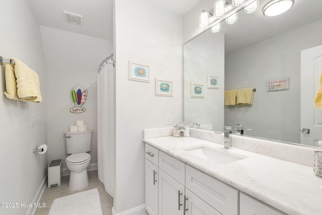 bathroom with vanity, toilet, baseboards, and visible vents