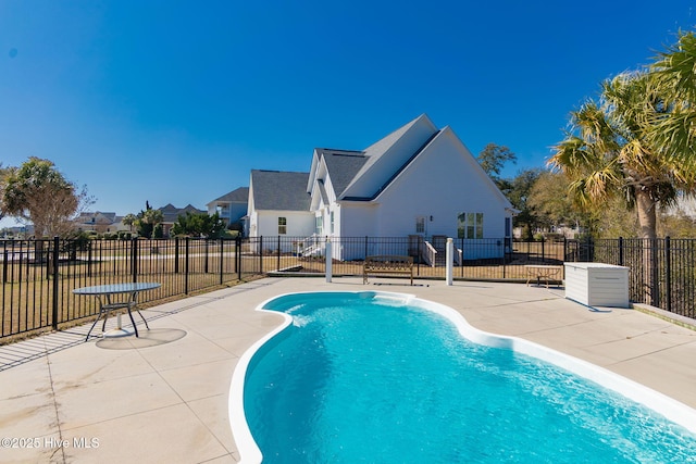 view of swimming pool with fence, a patio area, and a fenced in pool