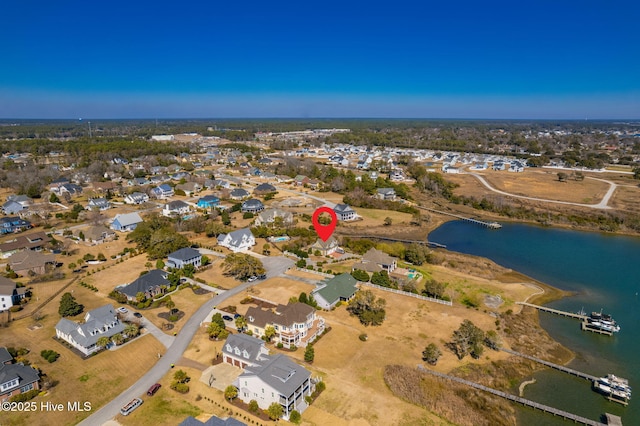 bird's eye view featuring a residential view and a water view