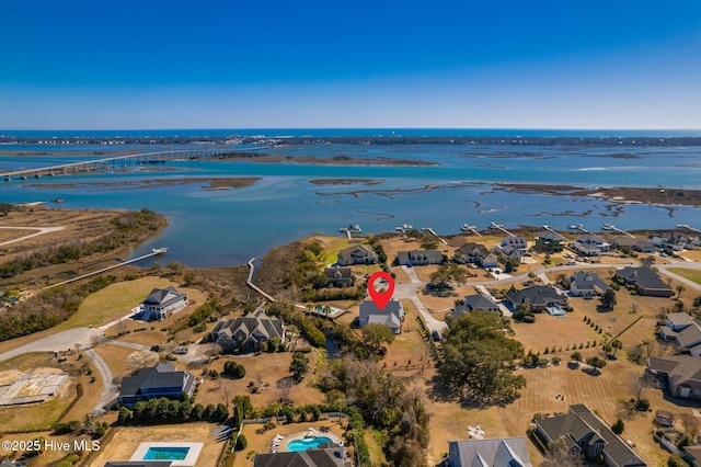 bird's eye view featuring a residential view and a water view