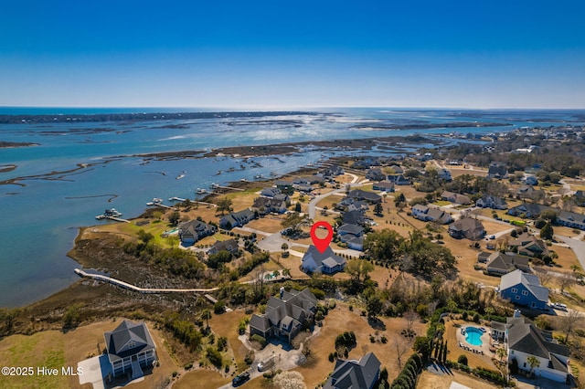 aerial view with a residential view and a water view