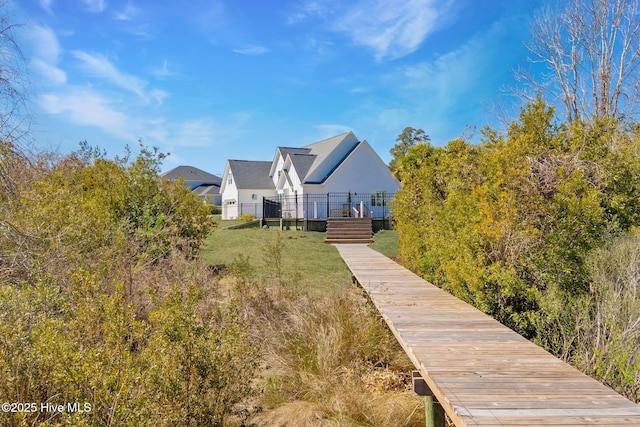 111 E Magens Ct, Cedar Point, NC 28584 - back of house featuring a lawn and stucco siding