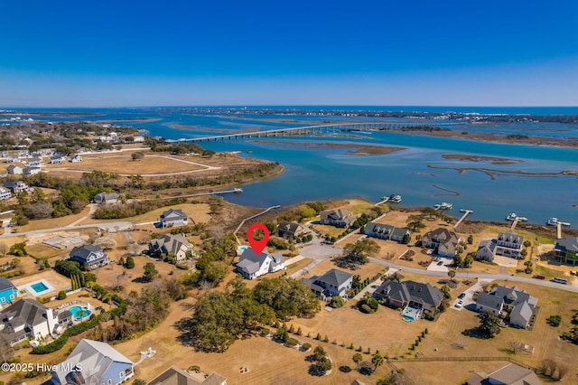 bird's eye view with a residential view and a water view