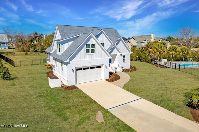 111 E Magens Ct, Cedar Point, NC 28584 - view of front facade with board and batten siding, an attached garage, driveway, and roof with shingles