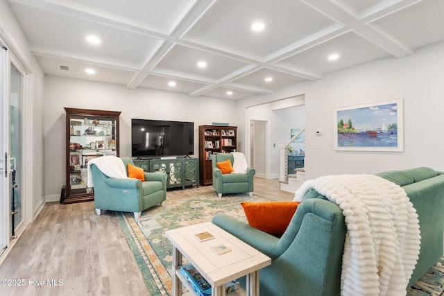 living room featuring light wood-type flooring, beam ceiling, coffered ceiling, recessed lighting, and stairway