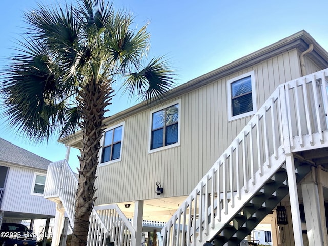 back of house featuring stairs