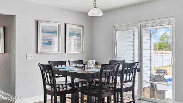 dining room featuring baseboards