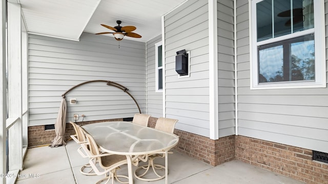 view of patio / terrace featuring outdoor dining area and a ceiling fan