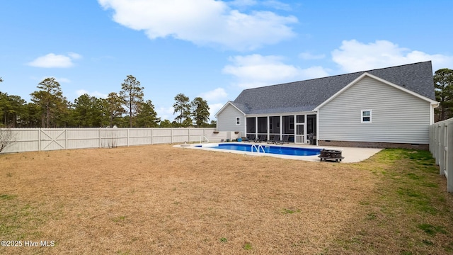 rear view of house with a fenced in pool, a lawn, a fenced backyard, a sunroom, and crawl space