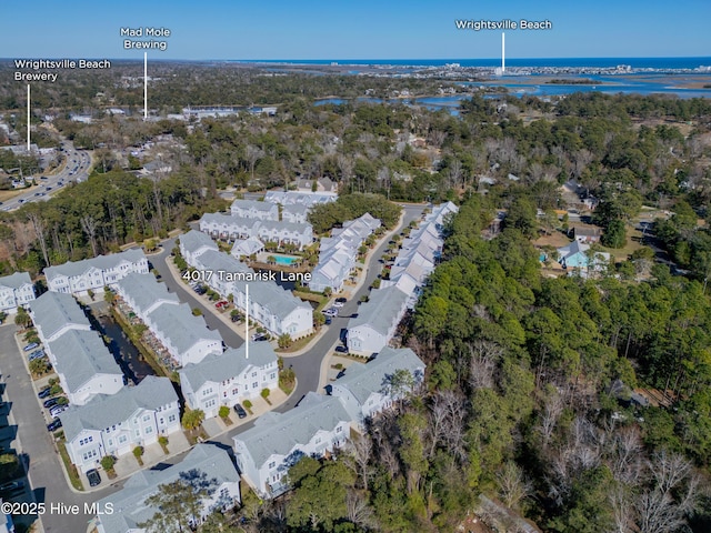 drone / aerial view with a residential view and a water view